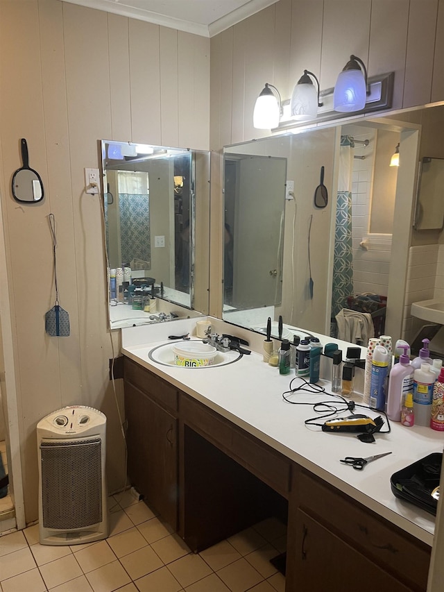 bathroom with tile patterned flooring, vanity, and ornamental molding