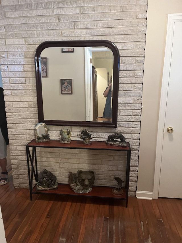 interior details featuring baseboards and wood finished floors