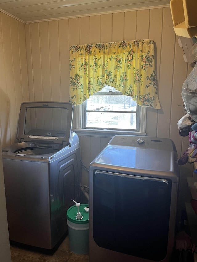 laundry area featuring washing machine and clothes dryer and laundry area