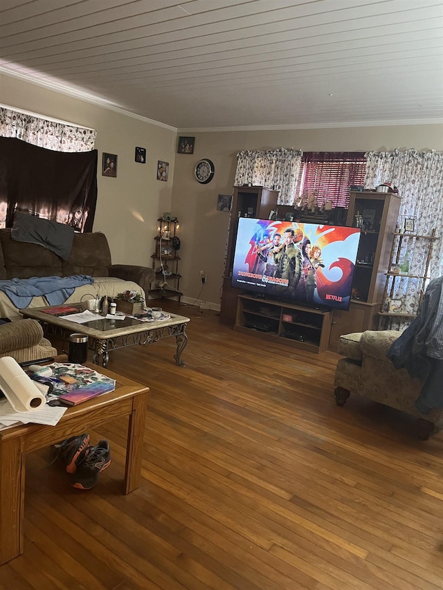 living area with wood finished floors, wood ceiling, and ornamental molding