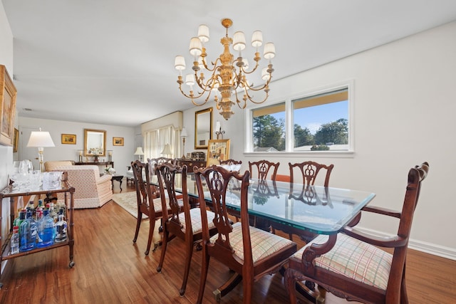 dining room featuring a chandelier and hardwood / wood-style flooring