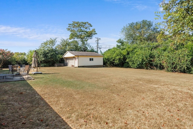 view of yard featuring an outbuilding and a patio