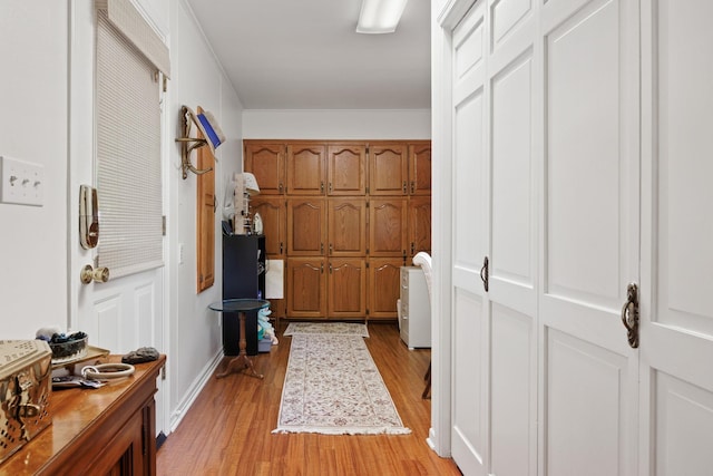 corridor featuring light hardwood / wood-style flooring