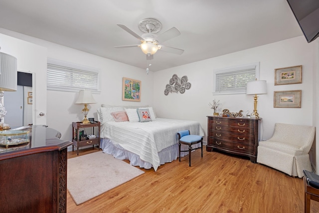 bedroom featuring ceiling fan and light wood-type flooring