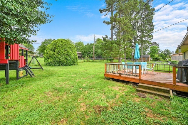  - view of yard featuring a deck and outdoor dining space
