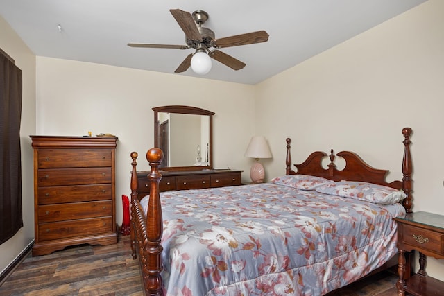 bedroom with ceiling fan and dark wood-type flooring