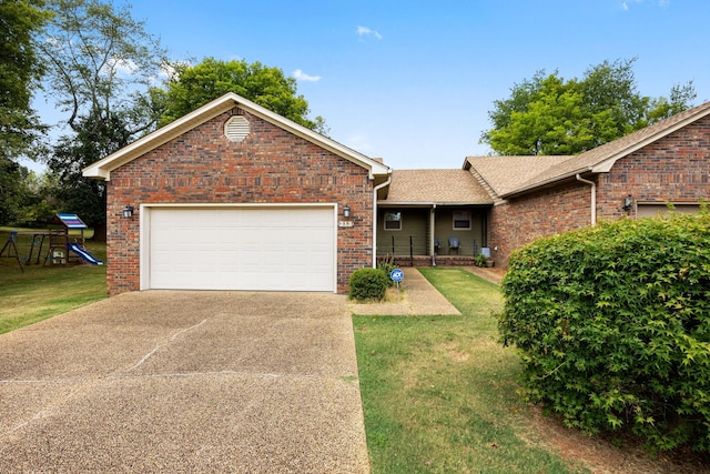 ranch-style house with a garage and a front yard