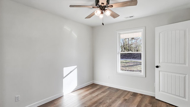 spare room featuring ceiling fan and hardwood / wood-style floors