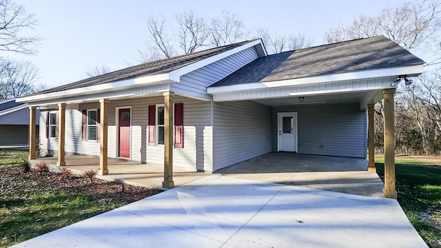 view of front of house with a carport and a porch