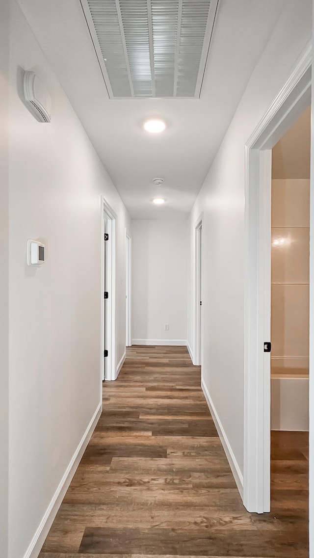 hallway featuring dark hardwood / wood-style floors