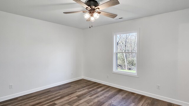 unfurnished room featuring dark hardwood / wood-style flooring and ceiling fan