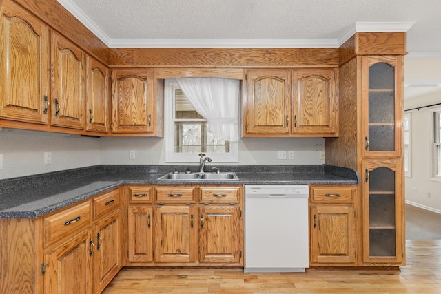 kitchen with crown molding, white dishwasher, light hardwood / wood-style floors, and sink