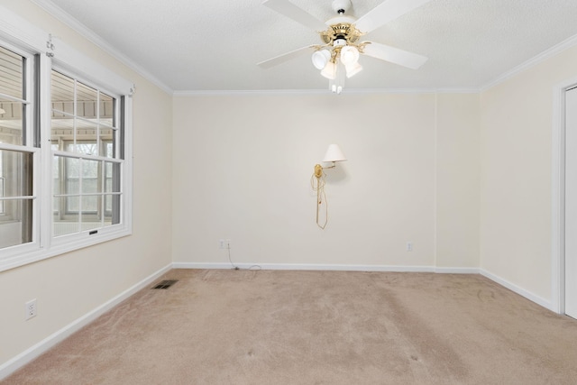 carpeted empty room with crown molding, a textured ceiling, and ceiling fan