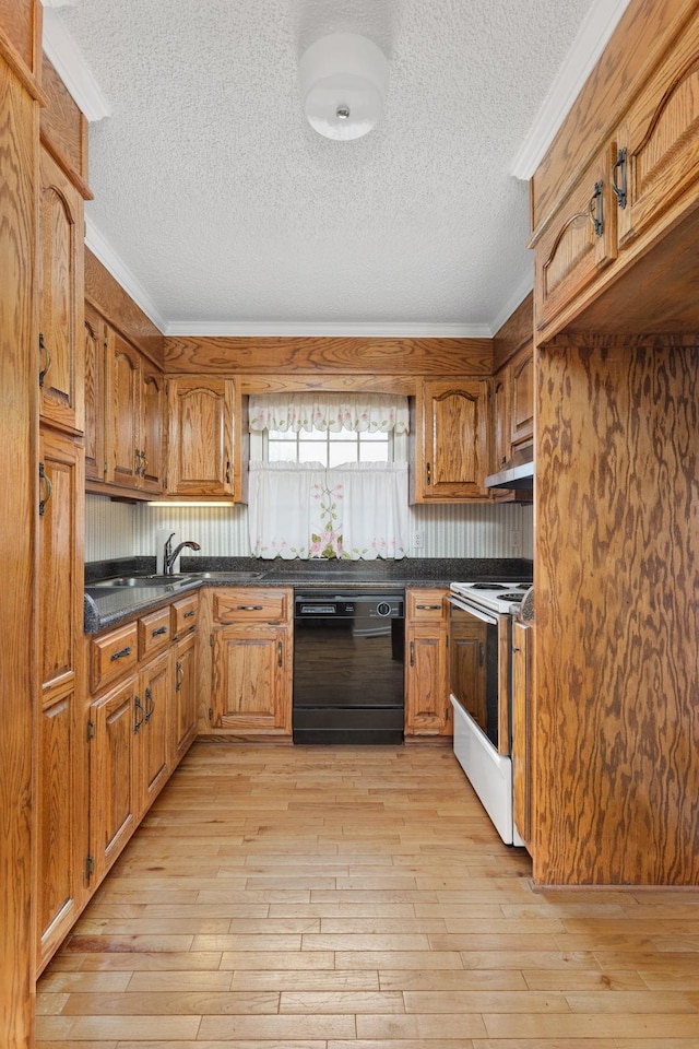 kitchen with ornamental molding, black dishwasher, light wood-type flooring, and electric stove