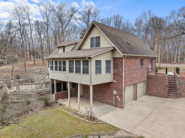 view of front of home featuring a garage and a deck