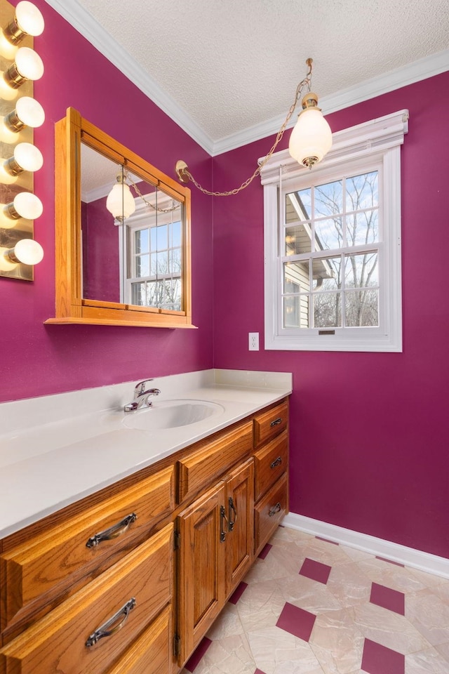 bathroom with vanity, ornamental molding, and a textured ceiling