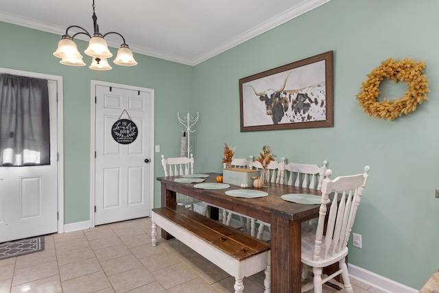 dining room featuring a chandelier, light tile patterned floors, and crown molding