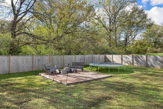 view of yard with a trampoline