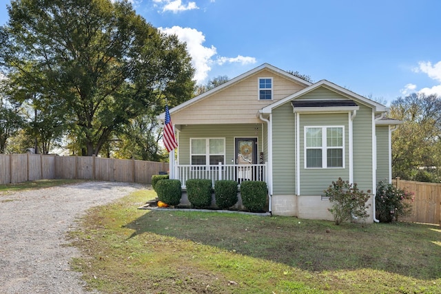 view of front of home featuring a front lawn and a porch