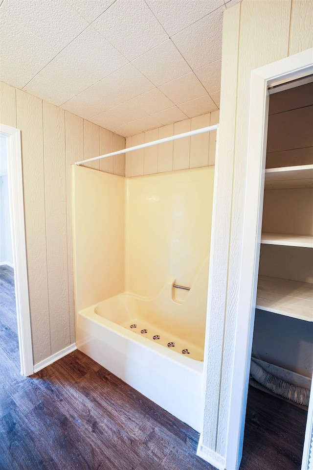 bathroom featuring wood-type flooring and a shower