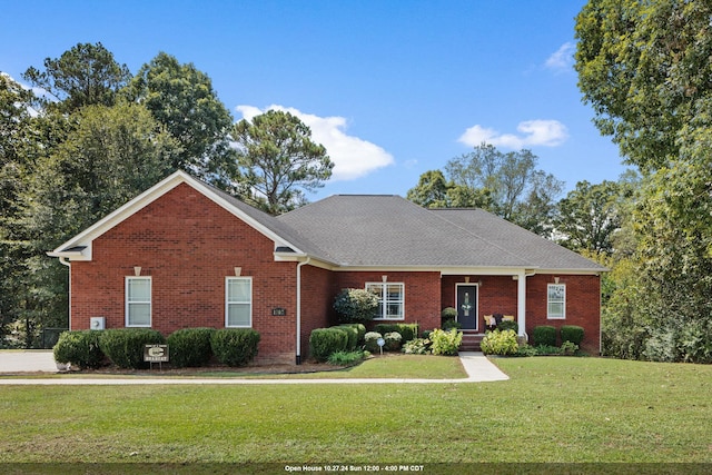 ranch-style home featuring a front yard