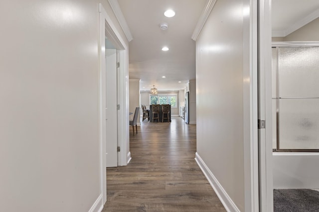 hall featuring ornamental molding, recessed lighting, dark wood-style flooring, and baseboards