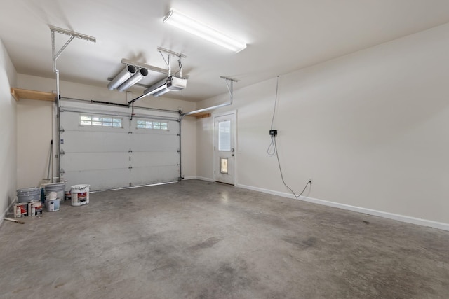 garage featuring baseboards and a garage door opener