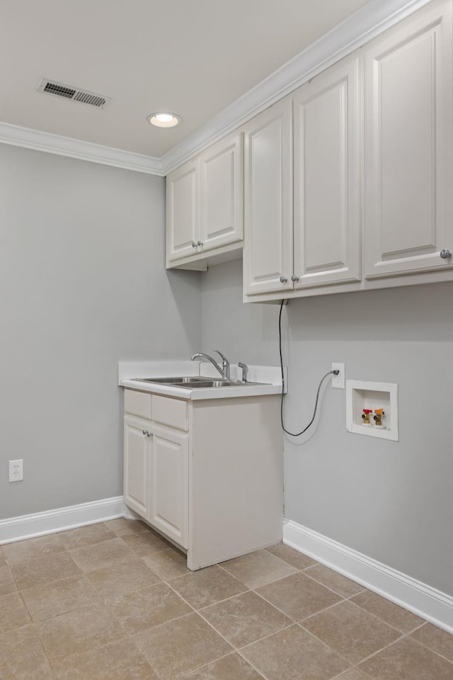 clothes washing area featuring cabinet space, visible vents, ornamental molding, washer hookup, and a sink