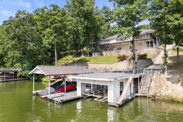 view of dock with a water view, stairway, and boat lift