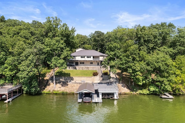 exterior space featuring a water view and a view of trees