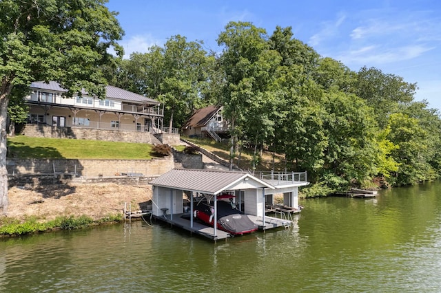 view of dock with a water view, boat lift, and stairs