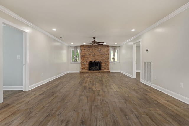 unfurnished living room with dark wood-type flooring, a fireplace, visible vents, and baseboards