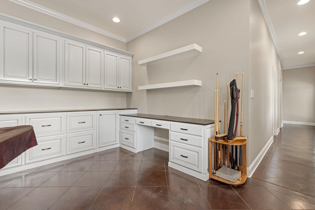 unfurnished office with recessed lighting, ornamental molding, built in study area, dark tile patterned flooring, and baseboards