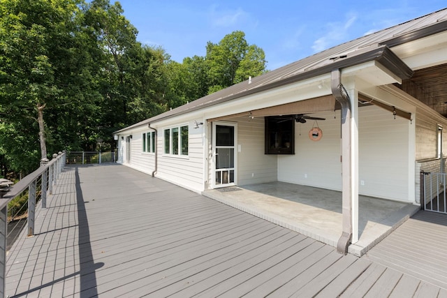 deck featuring a ceiling fan and a patio