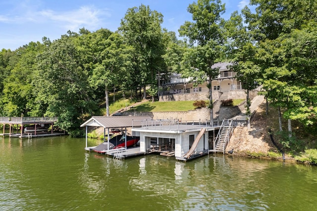 dock area with stairway, a water view, and boat lift