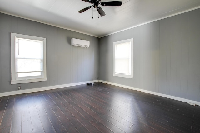 spare room with dark hardwood / wood-style floors, a wall mounted air conditioner, and ceiling fan