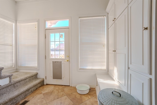 entryway featuring light tile patterned floors