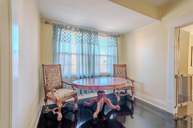 sitting room with dark hardwood / wood-style flooring and ornamental molding