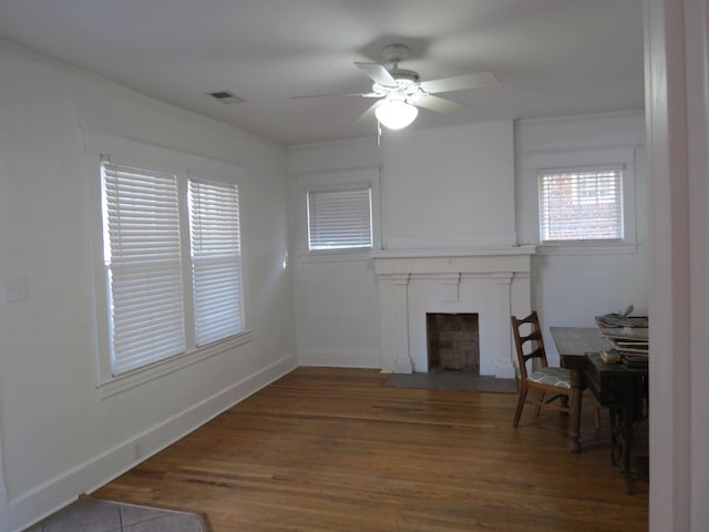 unfurnished living room featuring dark hardwood / wood-style floors and ceiling fan