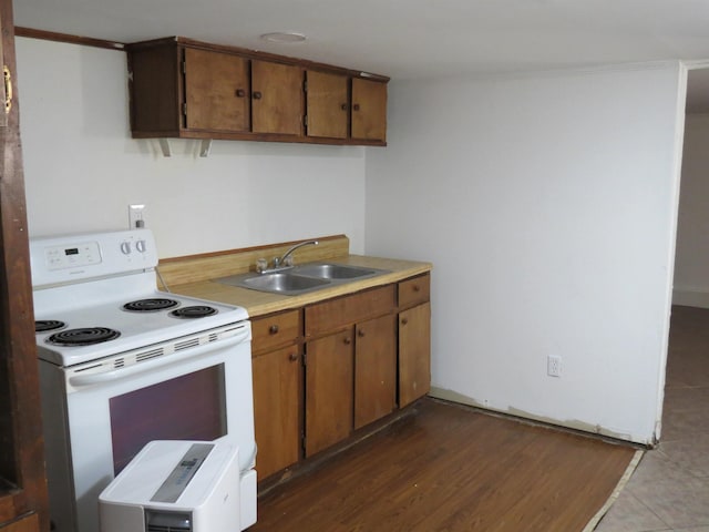 kitchen with sink and white electric range