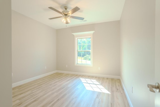 spare room featuring ceiling fan and light wood-type flooring