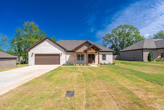 view of front of house with a garage and a front yard