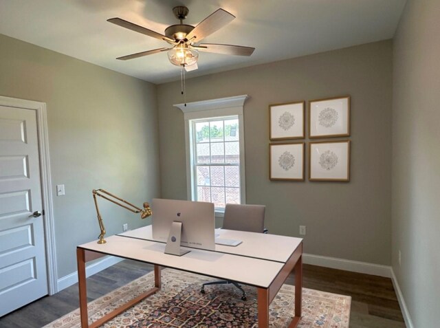 office area featuring dark hardwood / wood-style floors and ceiling fan