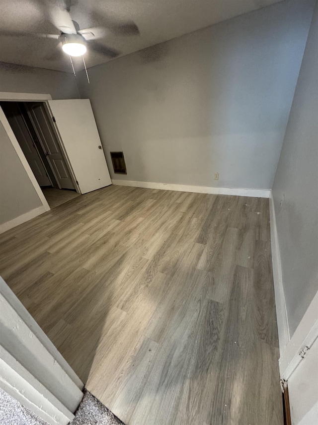 - empty room with wood finished floors and ceiling fan