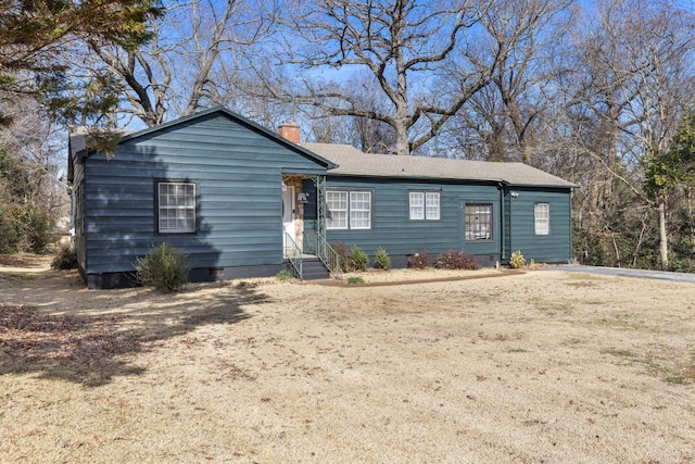 ranch-style home featuring a front yard