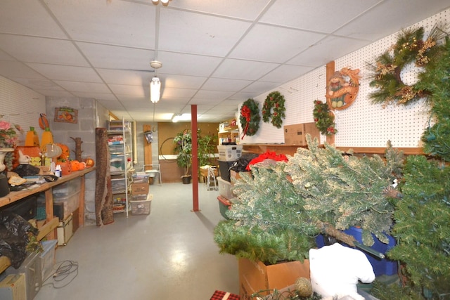 basement featuring a paneled ceiling