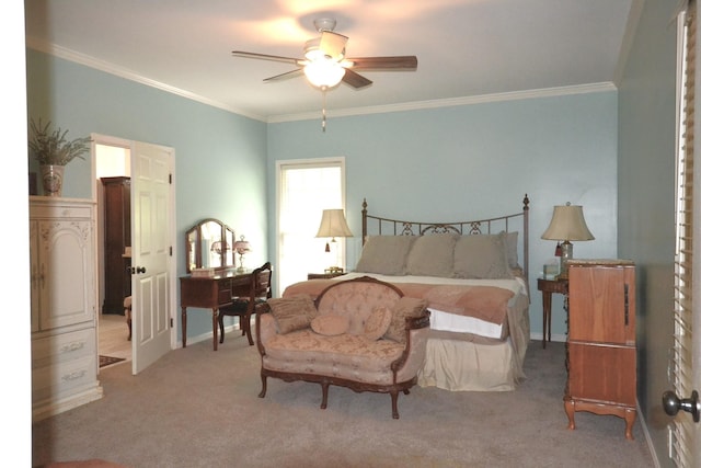 carpeted bedroom featuring ceiling fan and ornamental molding