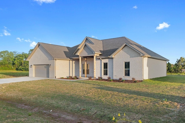 view of front of house with a garage, brick siding, a front yard, and concrete driveway