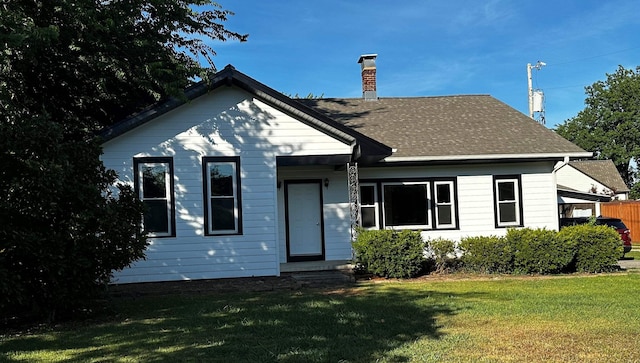 view of front of home with a front yard