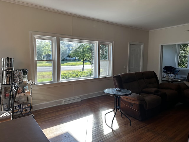 living room with hardwood / wood-style flooring and crown molding